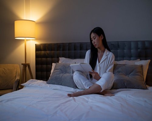 Cozy evening setting with dim lighting in a bedroom